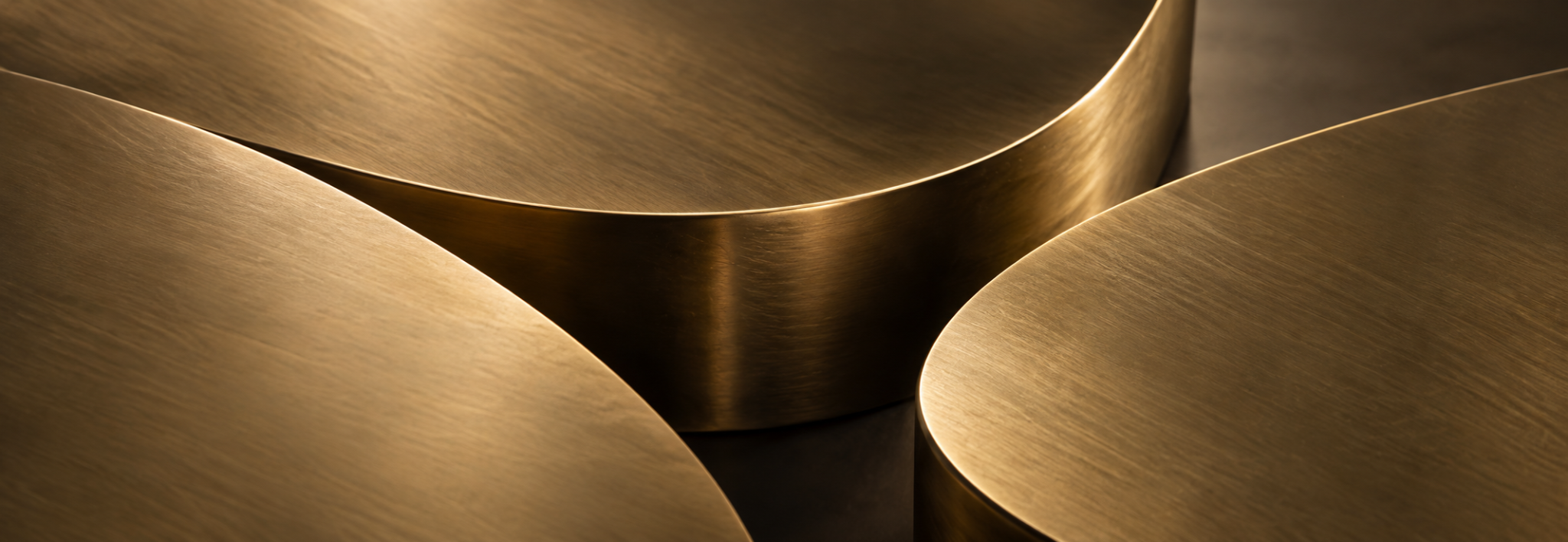 Brushed brass forms shaped by fire